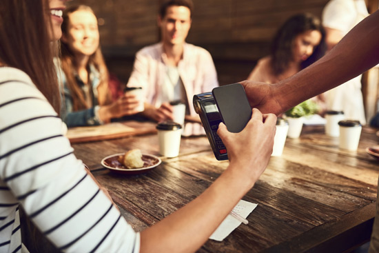 Woman Paying with Mobile POS